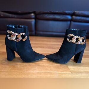 Rouge Helium Black Heeled Boots with Gold Chain luxury detail.